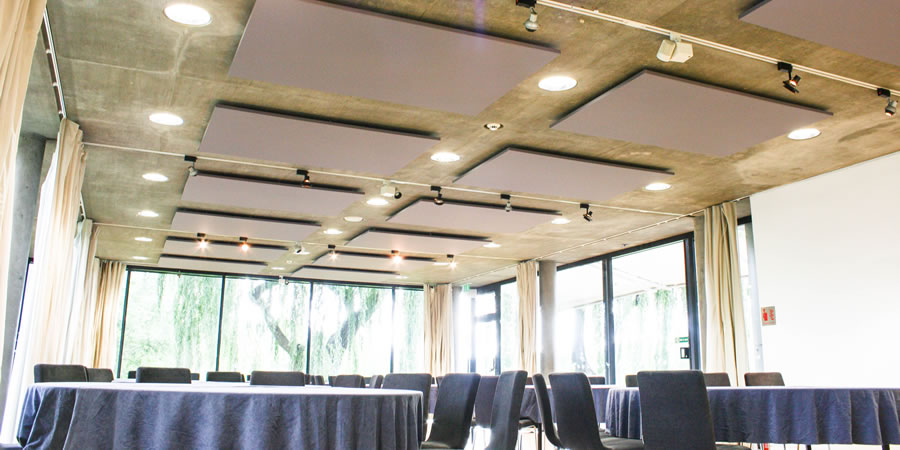 Acoustic panels suspended from the ceiling in a museum